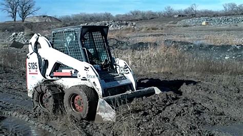 skid steer in muddy conditions|track loader stuck in mud.